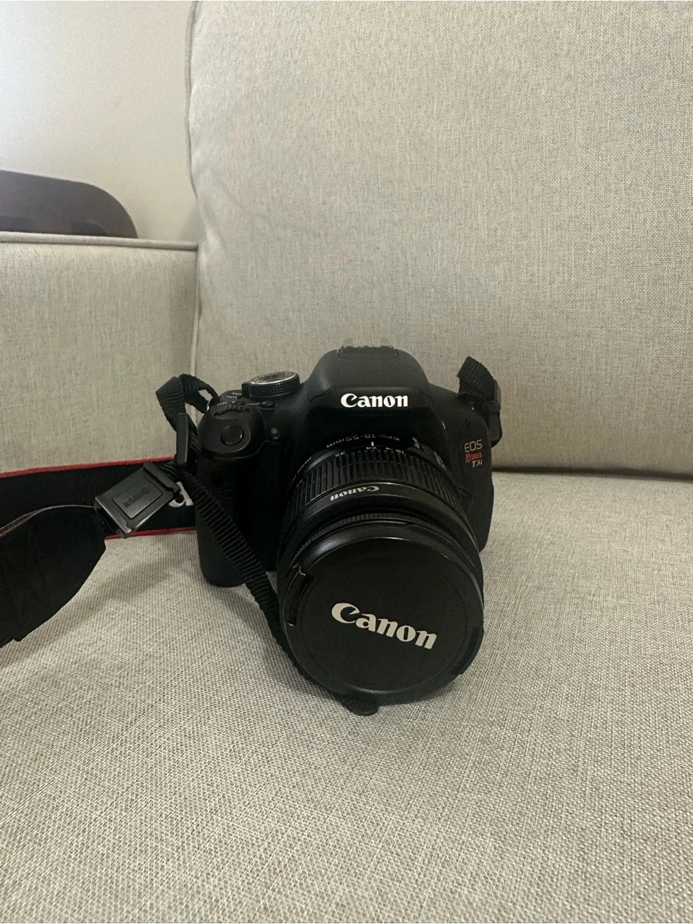 Canon DSLR Camera in Black with Red-Trim Strap